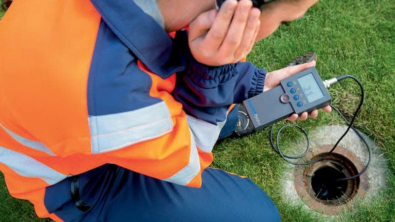 ZEPS technician using acoustic leak detection equipment
